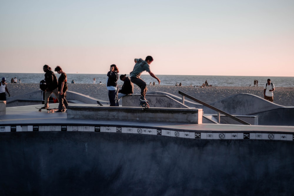 man in black t-shirt and black shorts running on gray concrete bridge during daytime