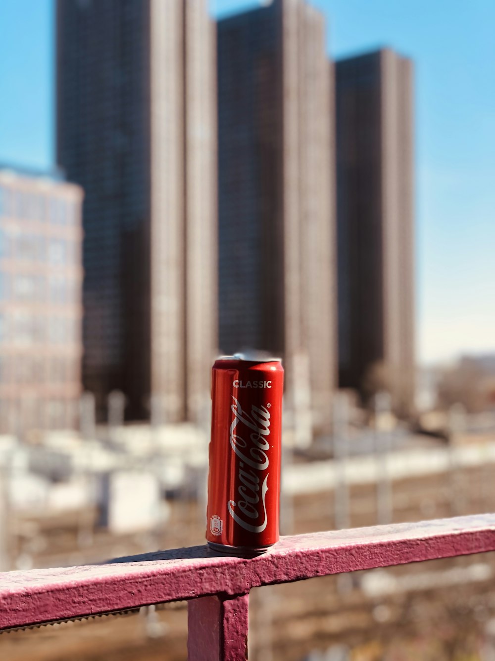 coca cola can on red table