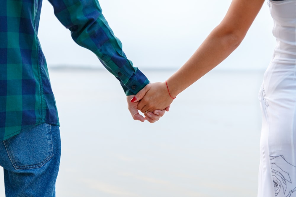 man and woman holding hands