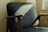 Elegant armchair in a modern living room with soft natural lighting.