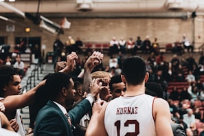 Team huddle showing unity and accountability before a game