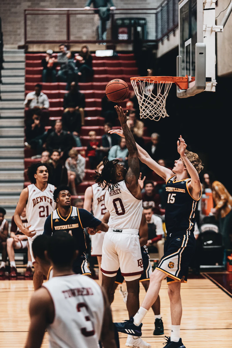 Basketball players playing on court