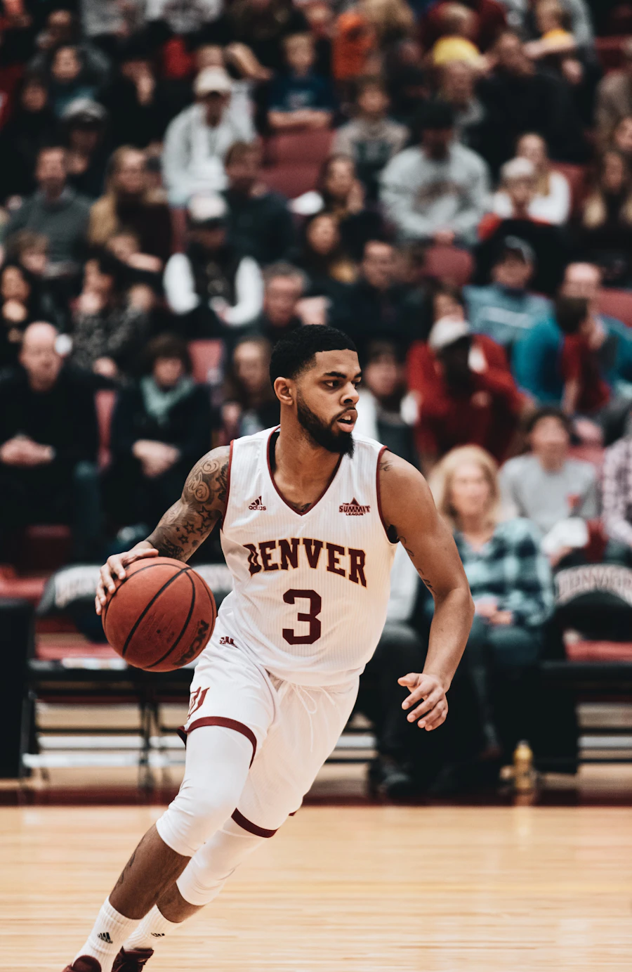 Basketball player holding the ball in dramatic light