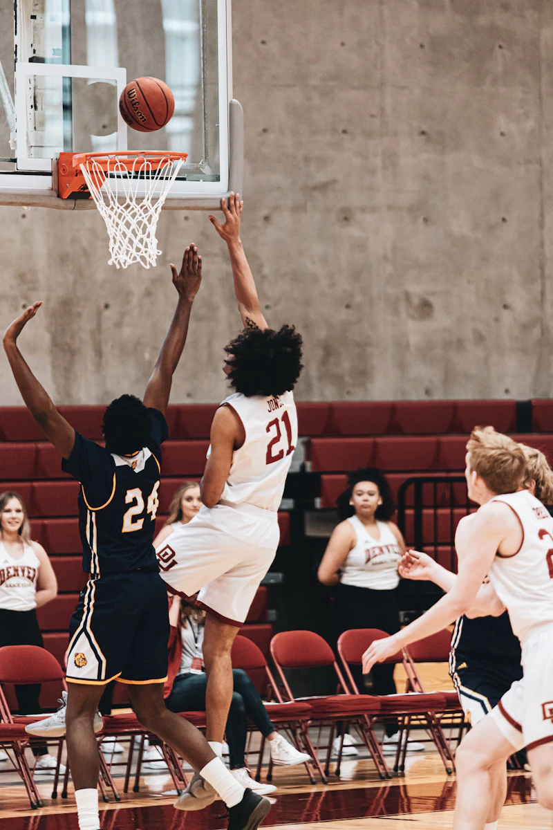 Basketball player in white and red jersey playing in a game