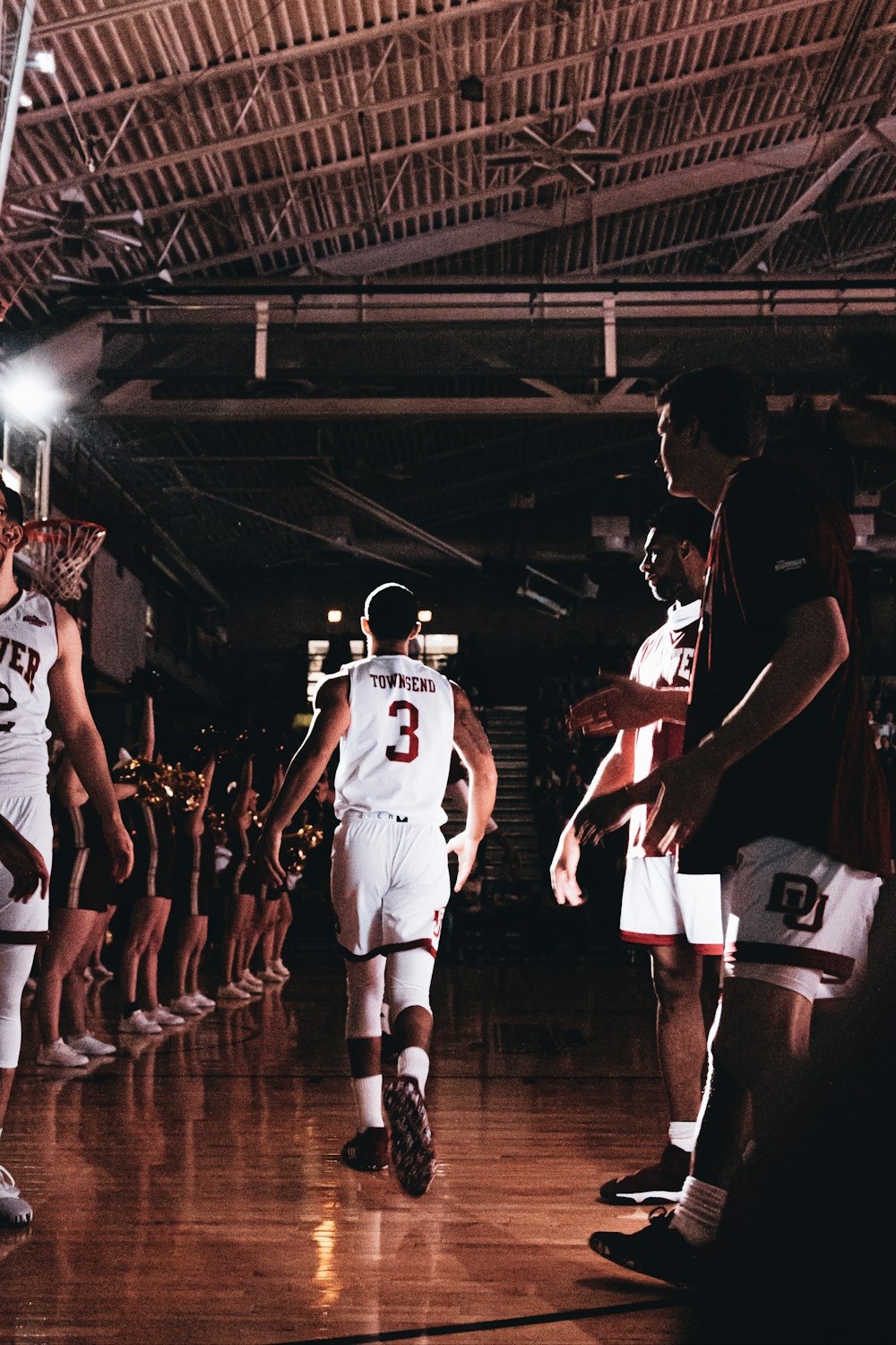 group of men playing basketball