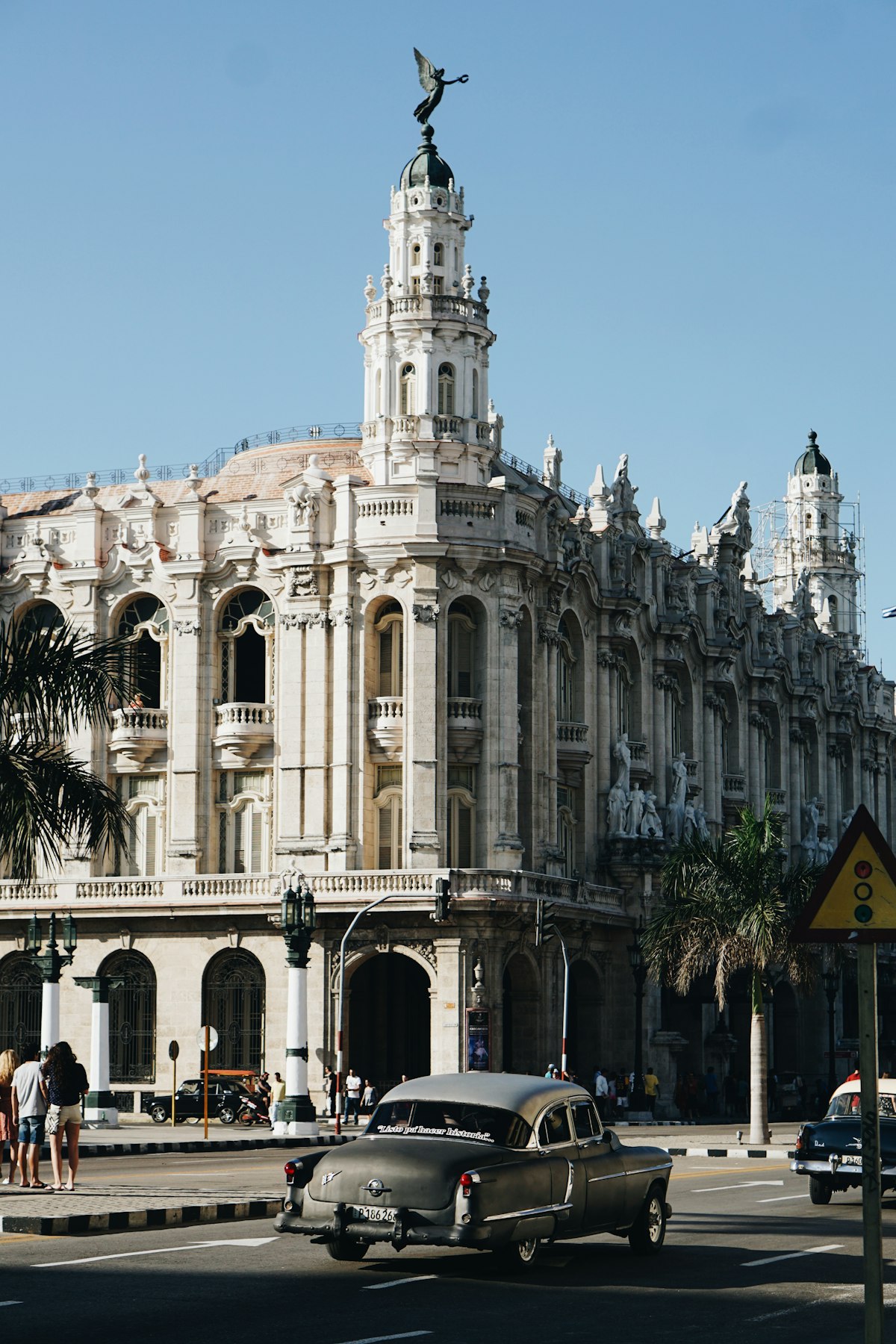 Havana October — the Gran Teatro de La Habana baroque facade on Parque Central with a vintage 1950s American car in front