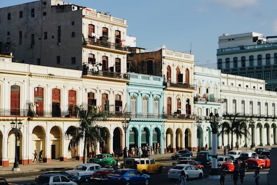 cars parked in front of building during daytime in Malecon Cuba