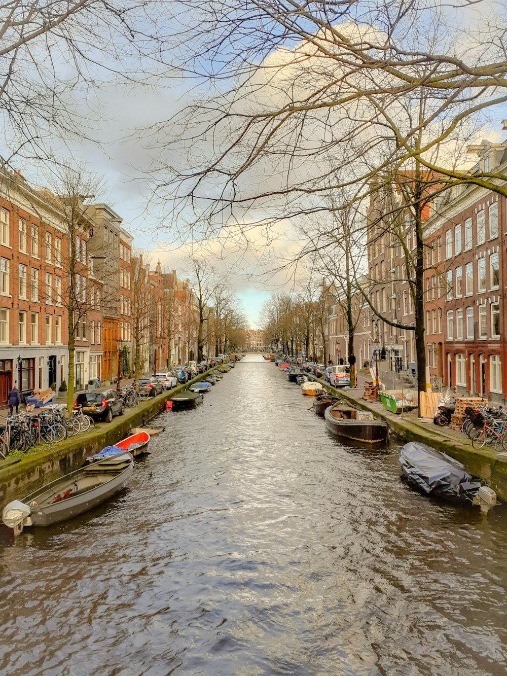 river between brown concrete buildings during daytime