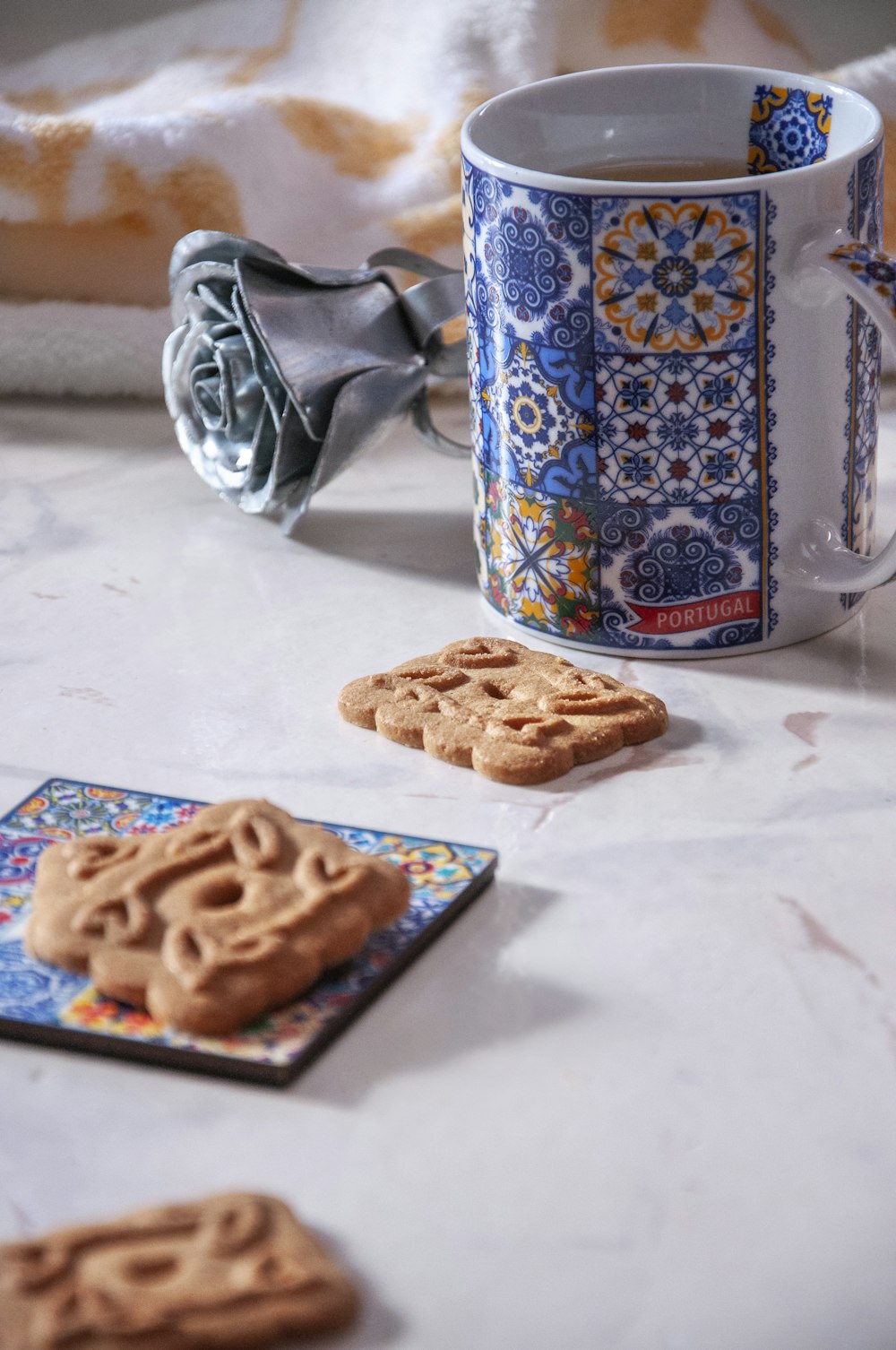 blue and red labeled can beside blue ceramic mug