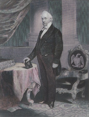 A professional portrait of Craig Stapleton in an office setting.