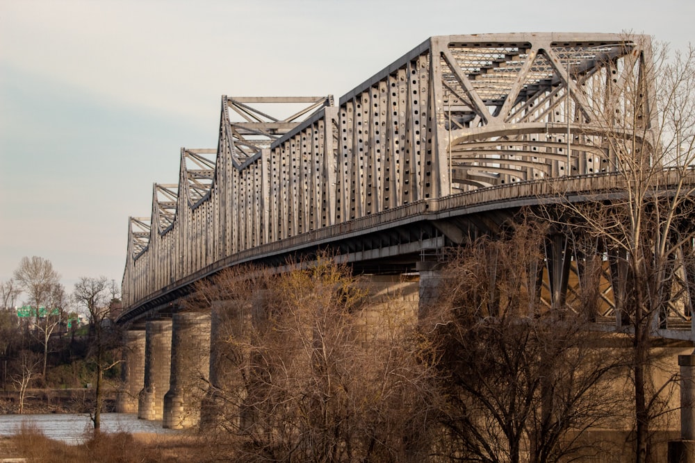gray metal bridge under gray sky