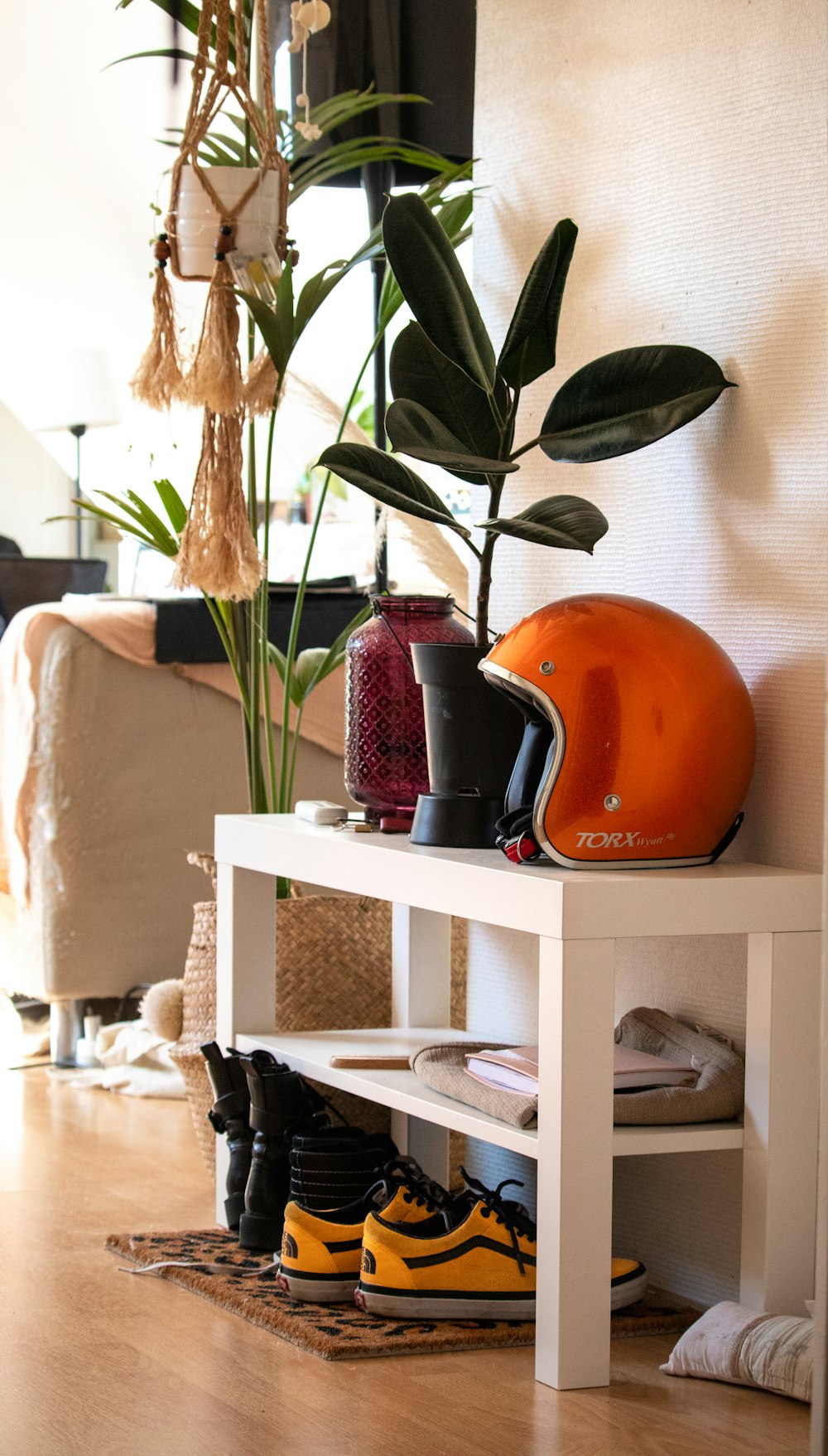 a shoe rack with a helmet on top of it