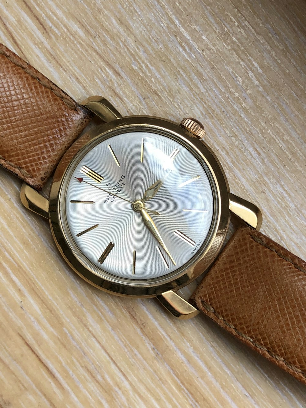 brown leather strap silver round analog watch