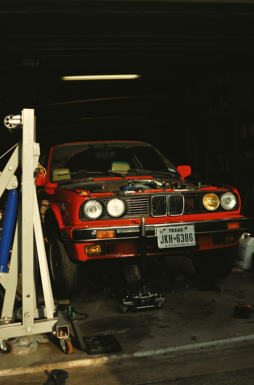 red and black car in a garage