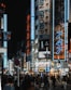 people walking on street during nighttime