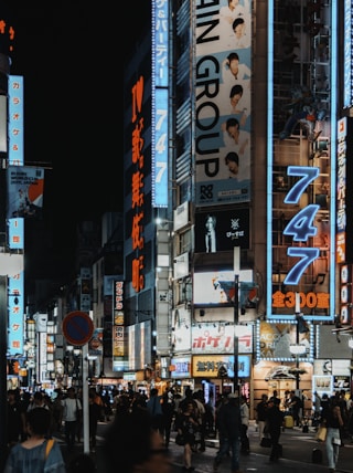 people walking on street during nighttime