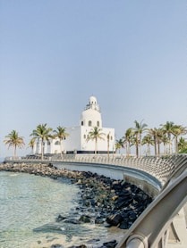 white concrete building near body of water during daytime