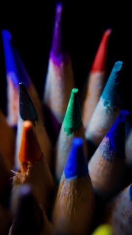 Close-up of sharpened pencils with vibrant colors ready for drawing.
