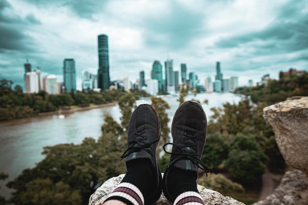 person wearing black running shoes