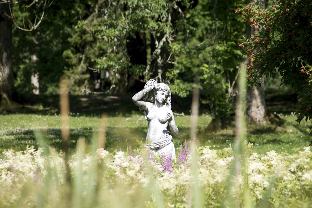 woman in white dress statue on water