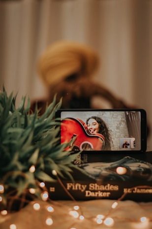 A close-up of a phone screen showing a voice call with a resurrected literary character.