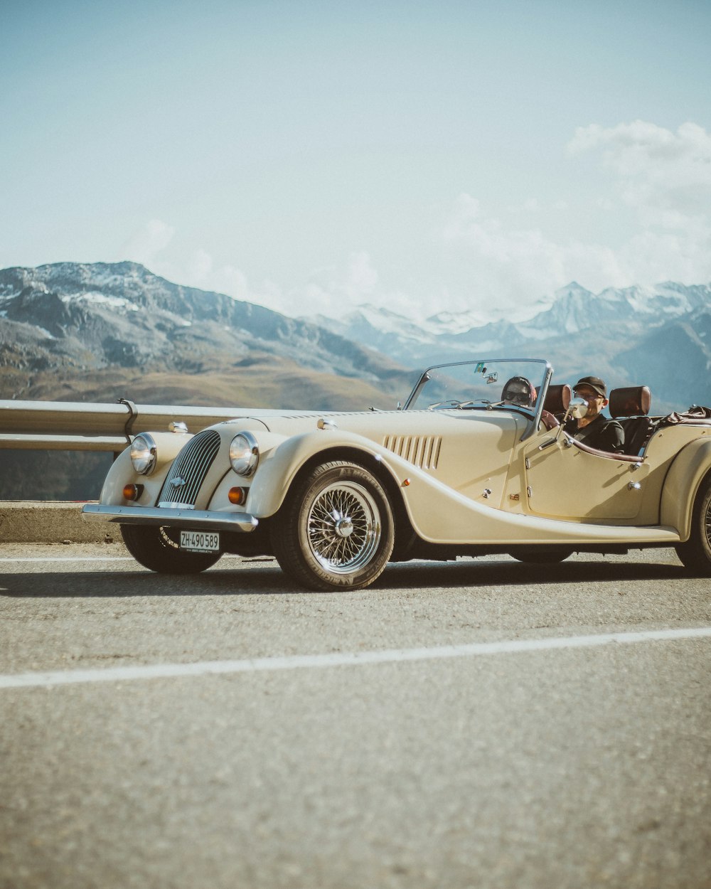 gold convertible coupe on road during daytime