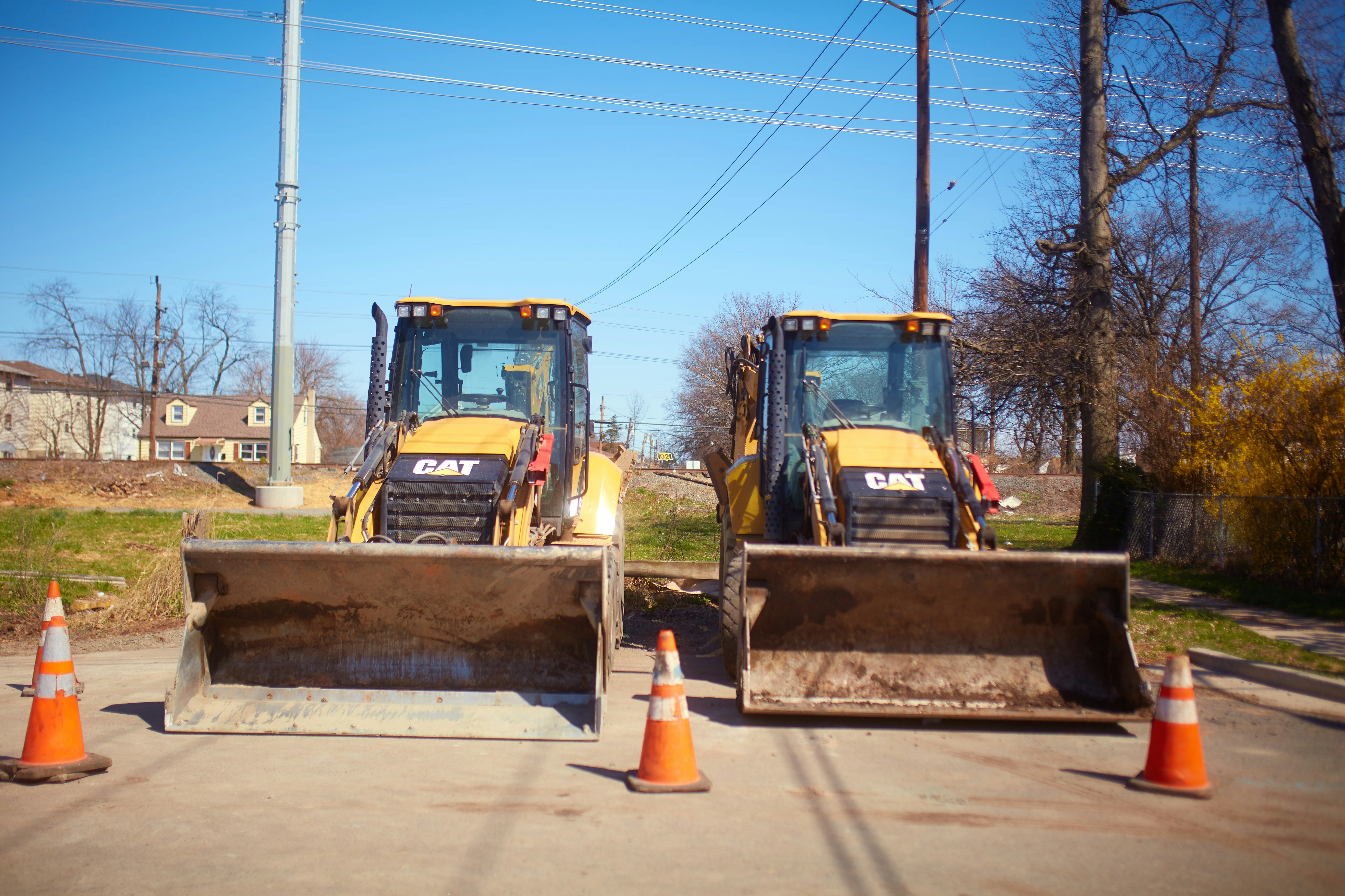 yellow and black heavy equipment on snow covered ground during daytime