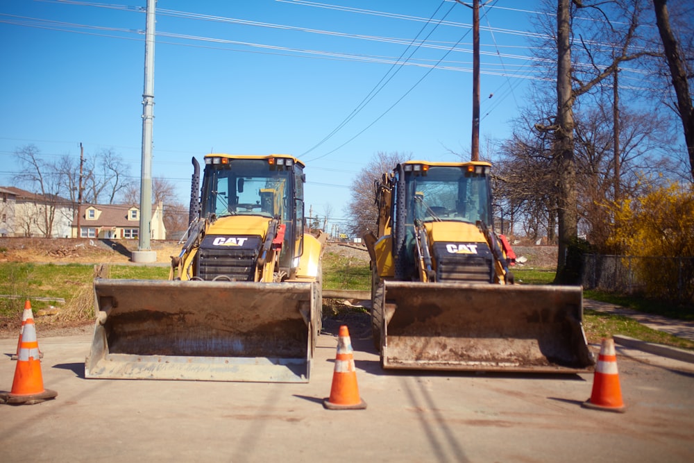 yellow and black heavy equipment on snow covered ground during daytime