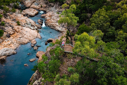 brown wooden bridge over river in Alligator Creek Queensland Australia