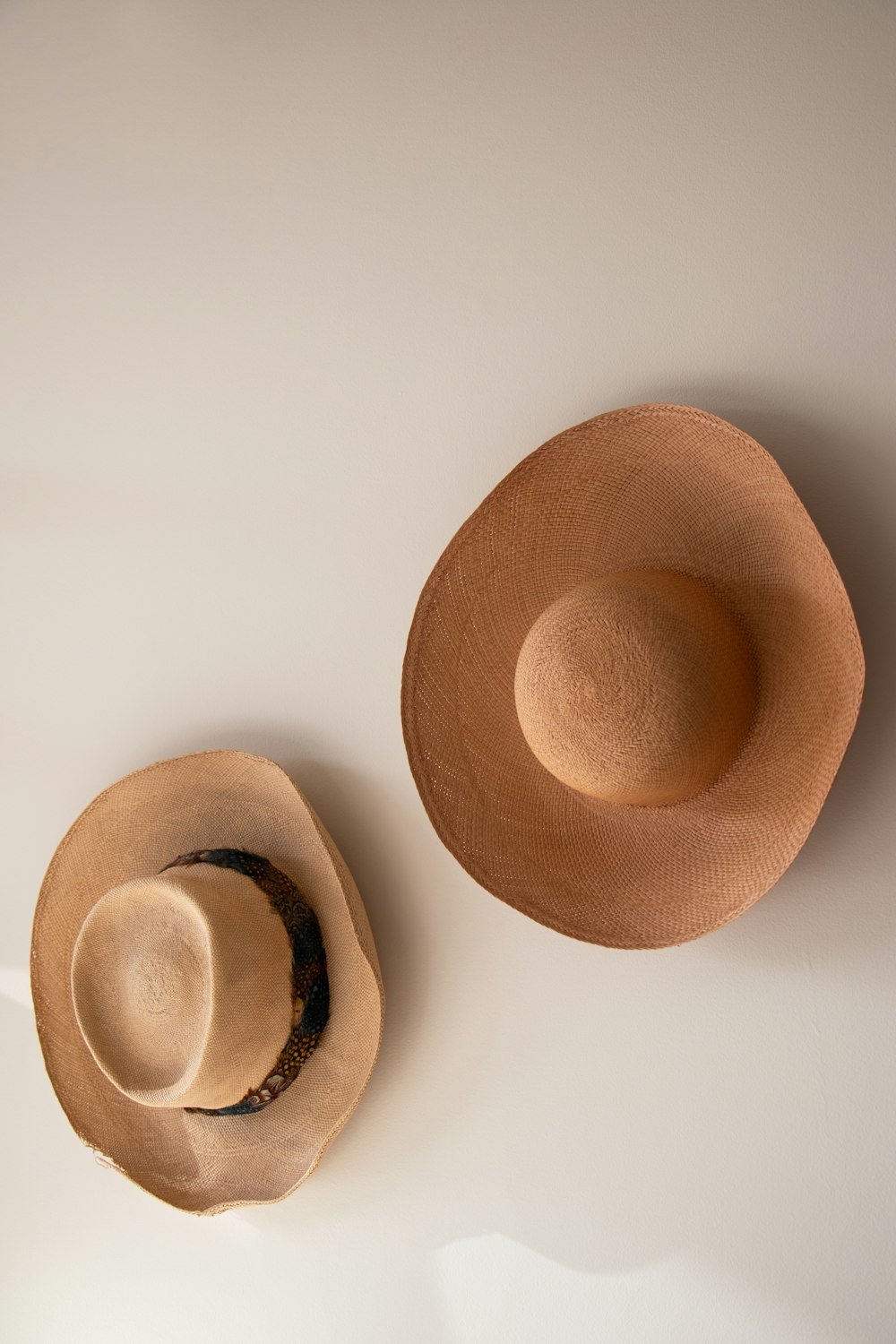 brown hat on white surface