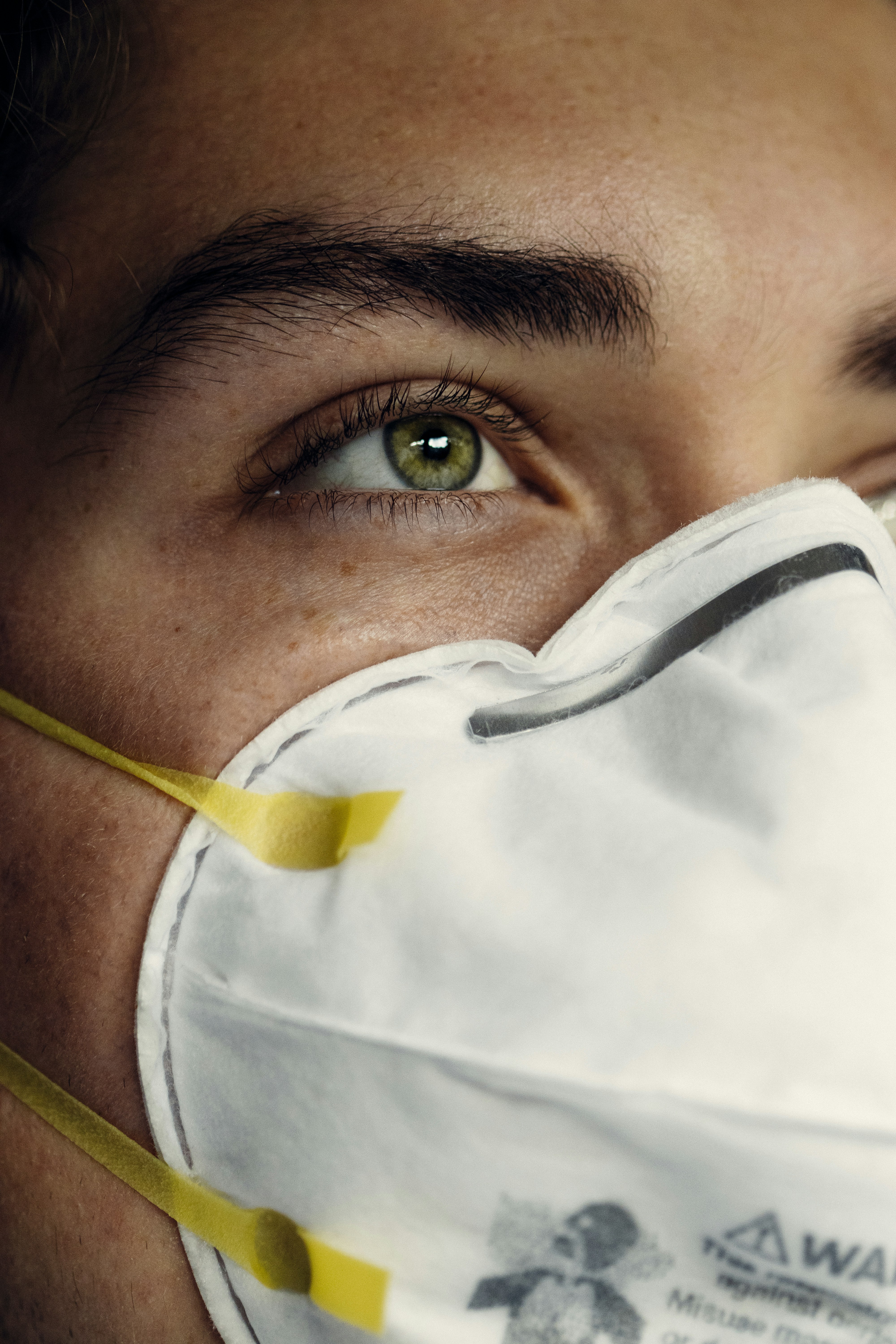 person in white face mask