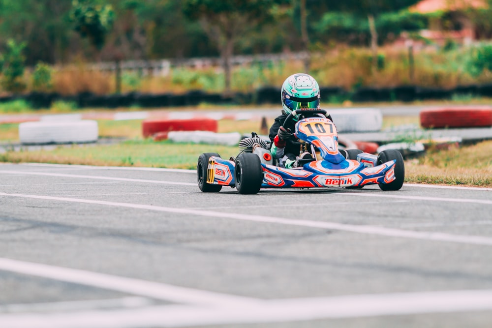 person riding on go kart