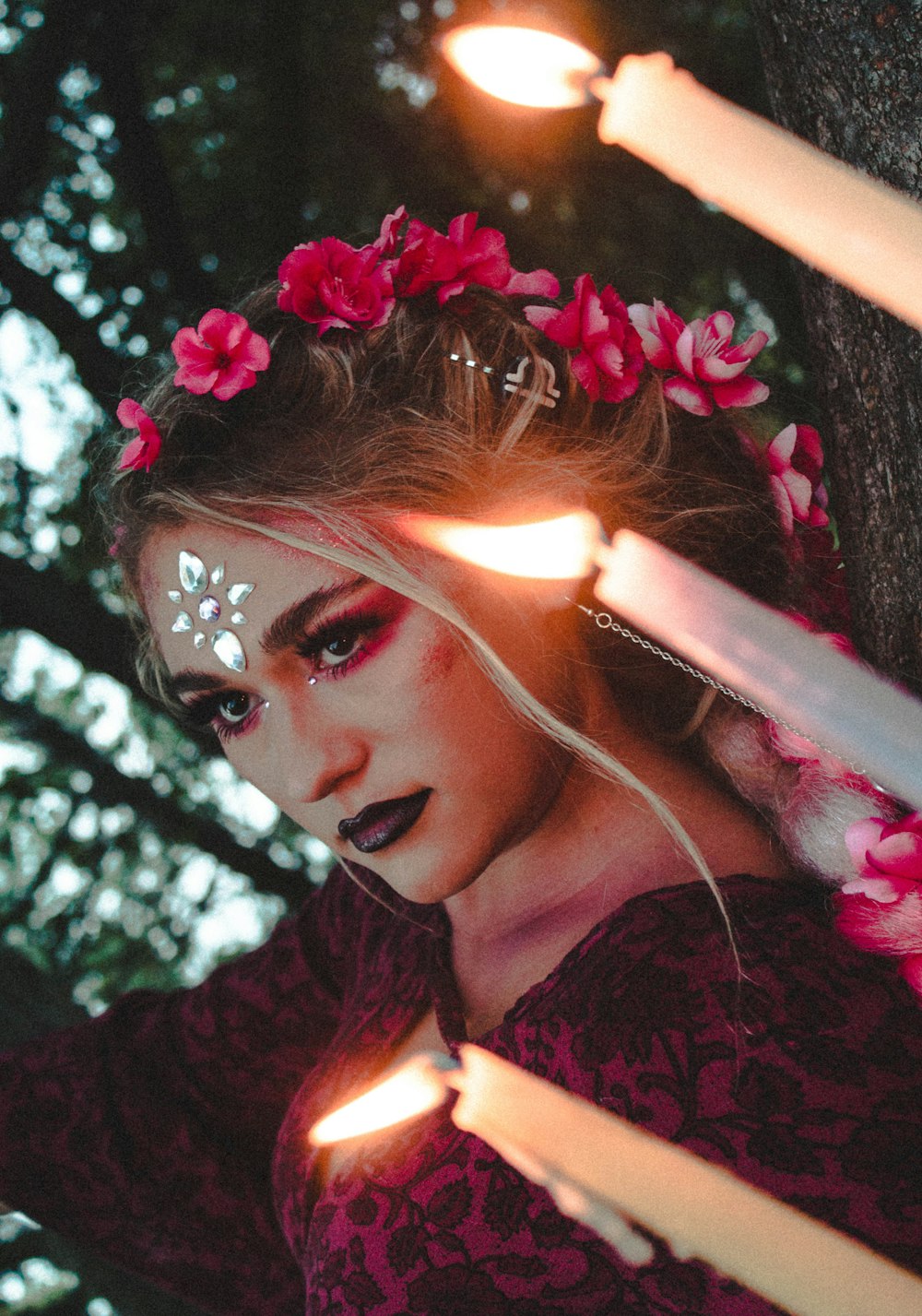 woman in red v neck shirt with red flower headdress