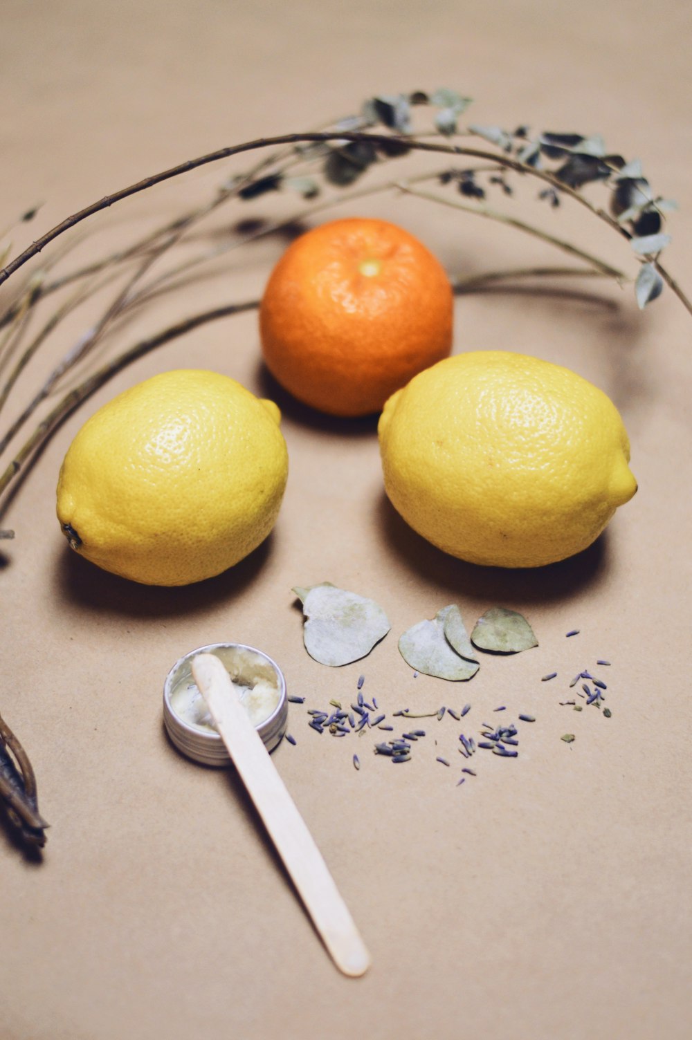 yellow lemon fruit beside silver fork on white and blue floral textile