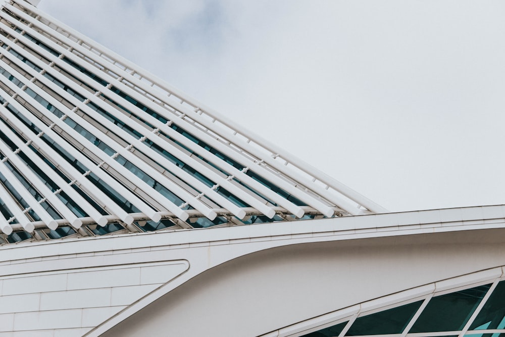 white concrete building under white clouds during daytime