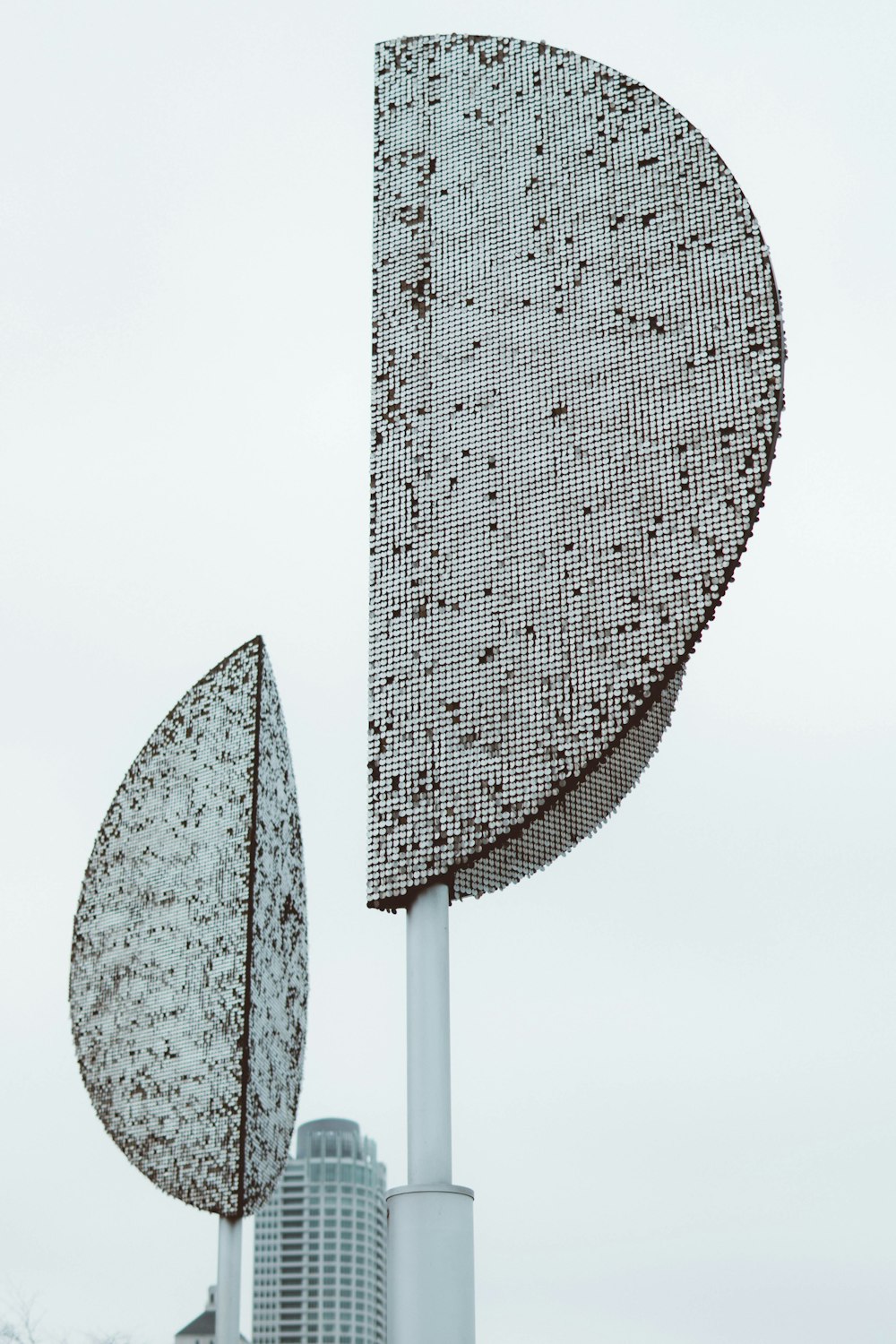 white and black umbrella under white sky