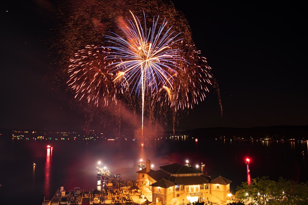 fireworks display over city during night time