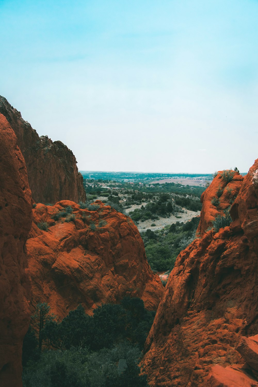 brown rock formation near body of water during daytime