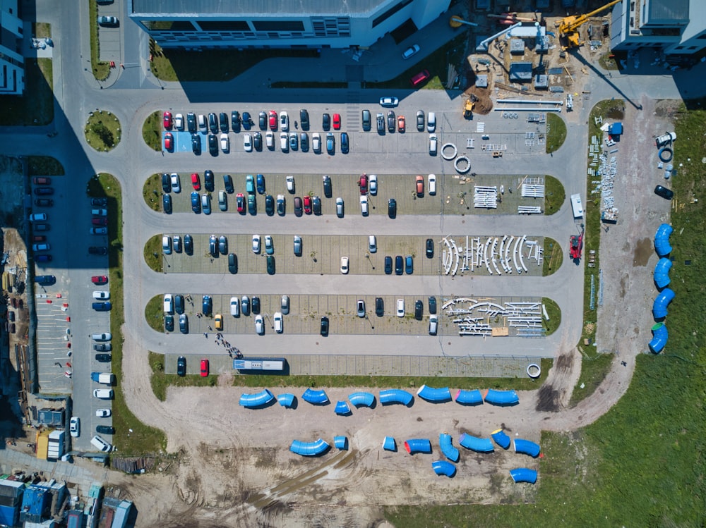 aerial view of cars parked on parking lot during daytime