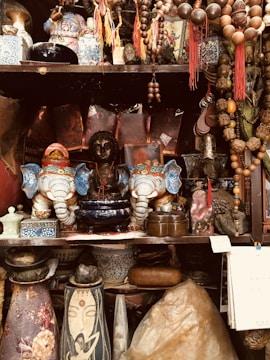 Various wooden decorative items including bowls and small sculptures