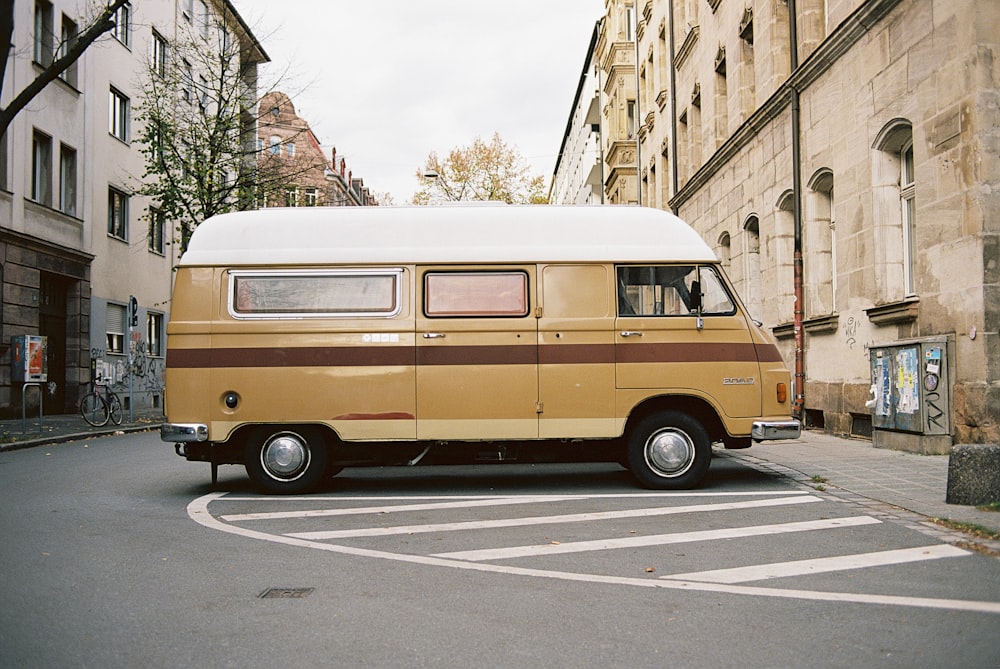 brown van parked on the side of the road