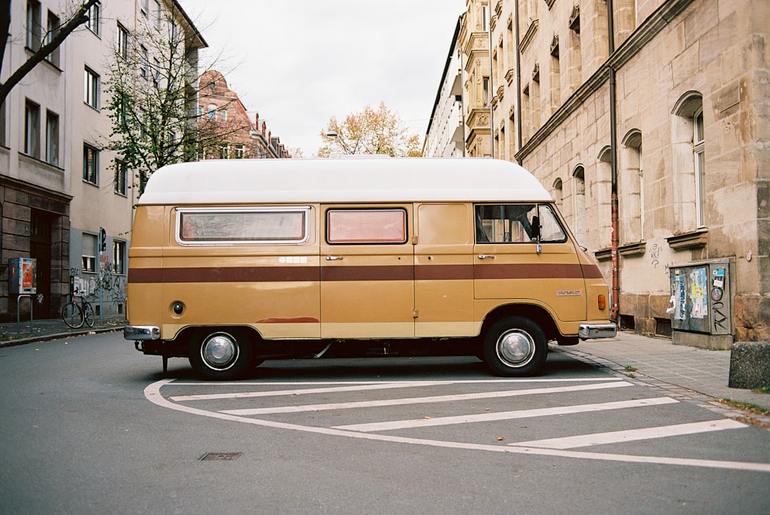 brown van parked on the side of the road