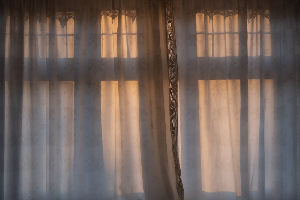 white and brown floral window curtain