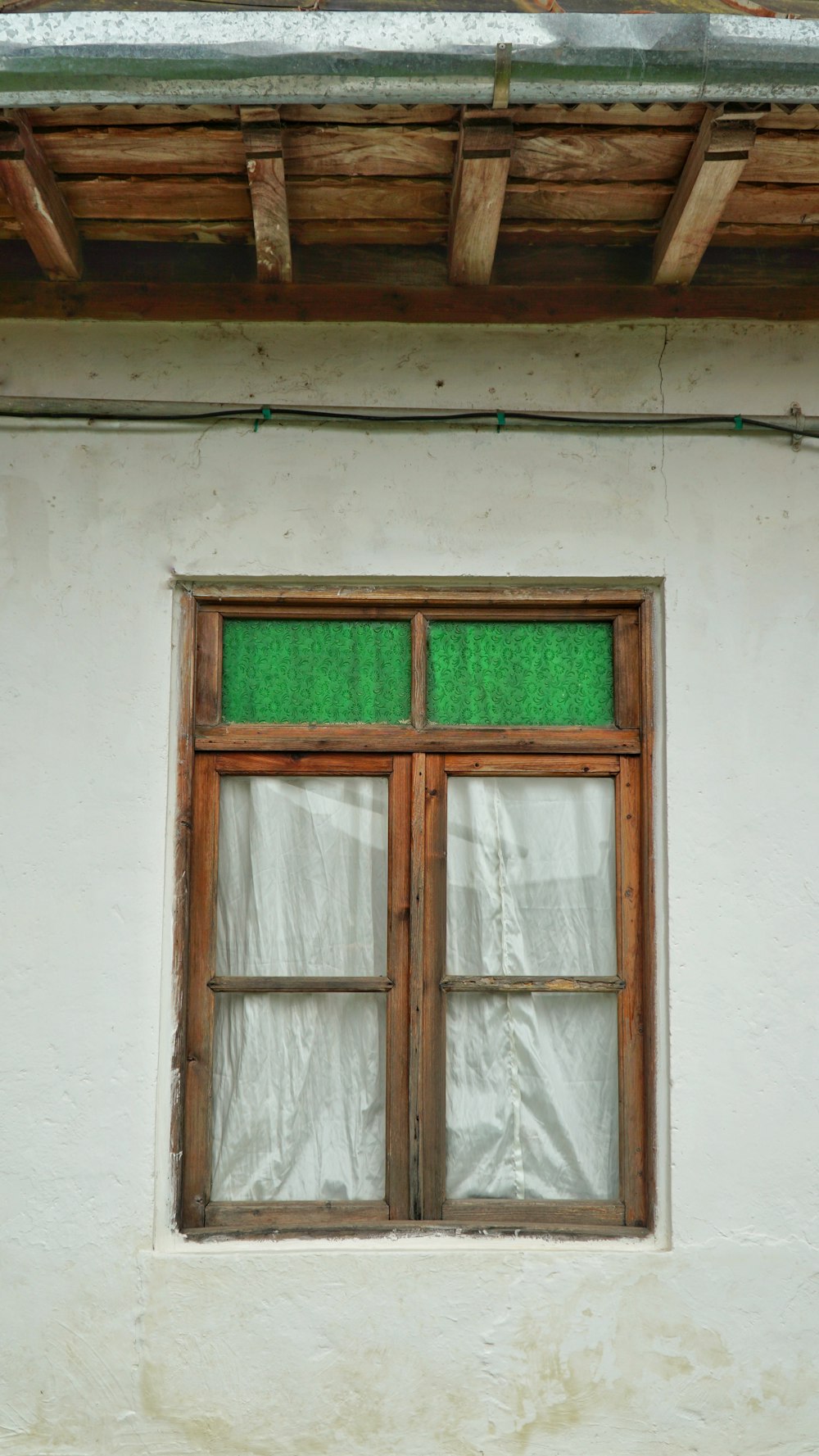 brown wooden framed glass window