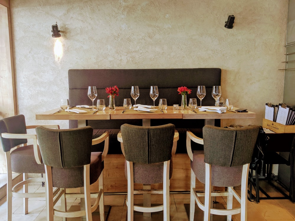 white and brown wooden table and chairs