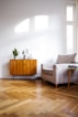 brown wooden table beside gray couch