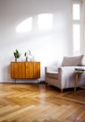 brown wooden table beside gray couch