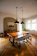 Photo of a modern industrial dining table set in a cozy home dining room.