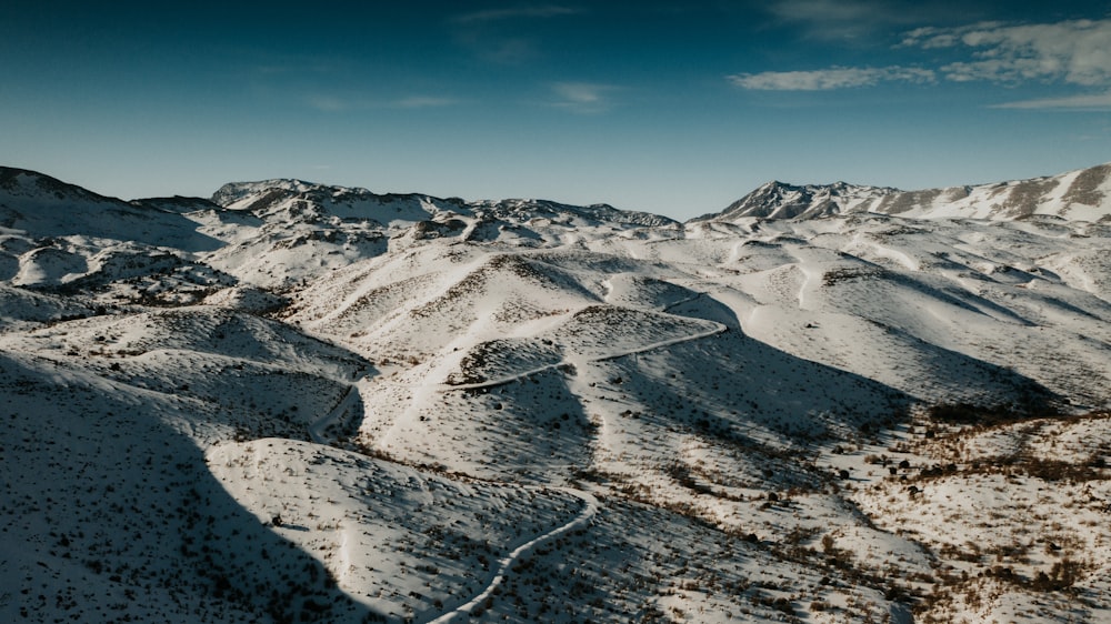 snow covered mountain under blue sky during daytime