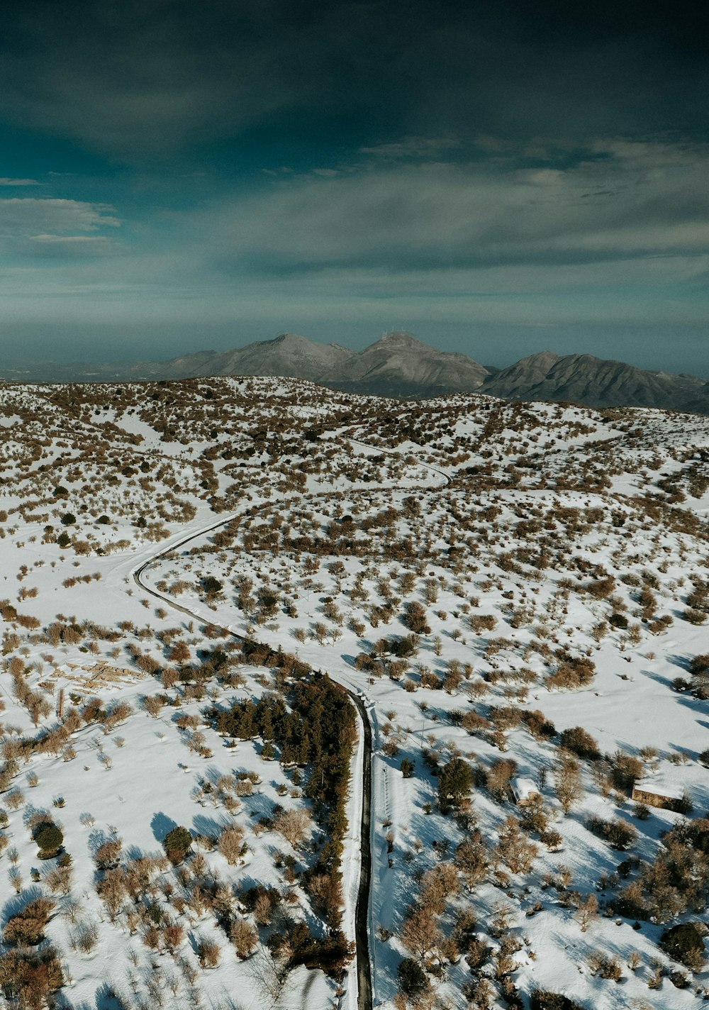 aerial view of snow covered mountain during daytime